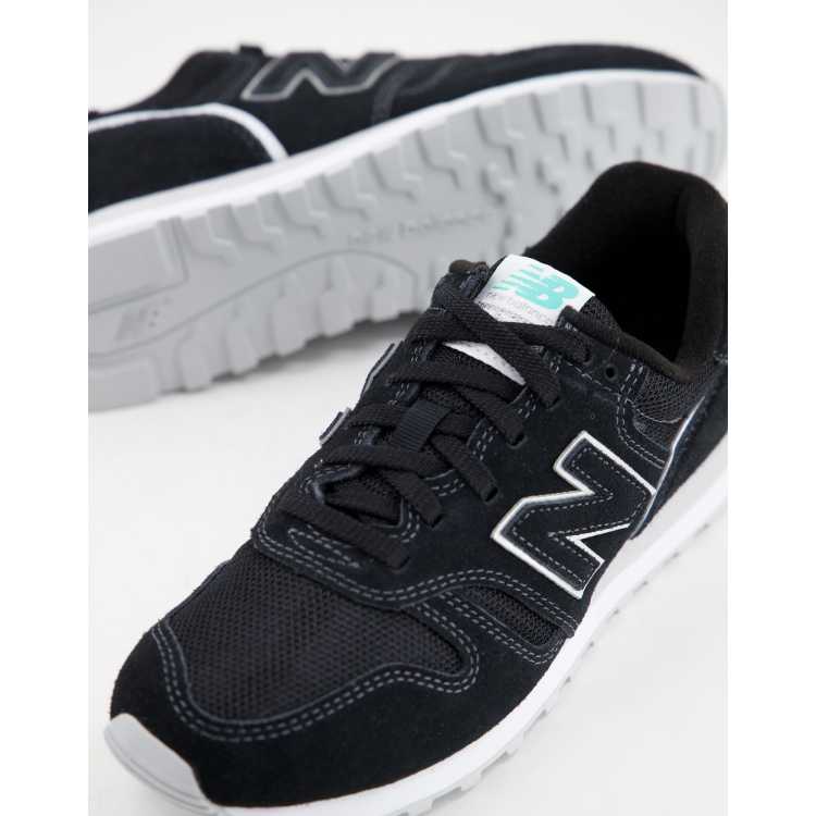 New Balance 373 sneakers in black aqua blue