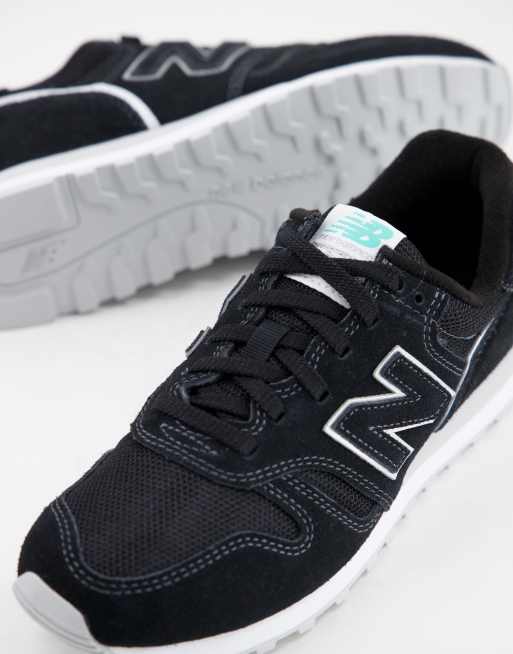 New Balance 373 sneakers in black/aqua blue