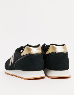 new balance black & gold 373 suede & mesh trainers