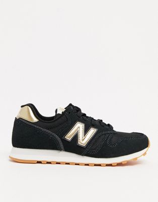 new balance black & gold 373 suede & mesh trainers