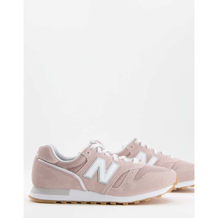 New Balance 373 sneakers in pink and white