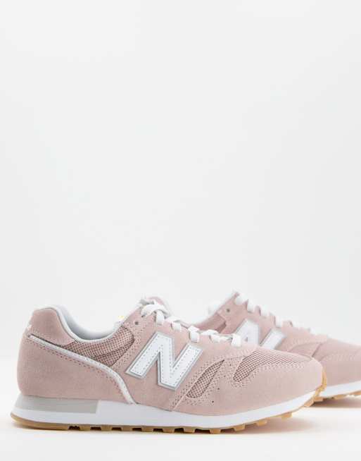 New Balance 373 sneakers in pink and white