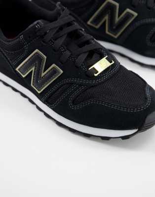 new balance trainers black and gold