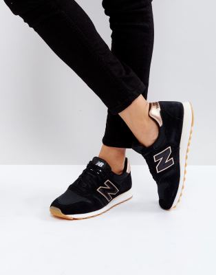 new balance black and gold 373