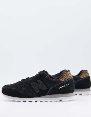 leopard and black trainers