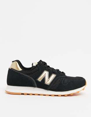 new balance black and gold trainers