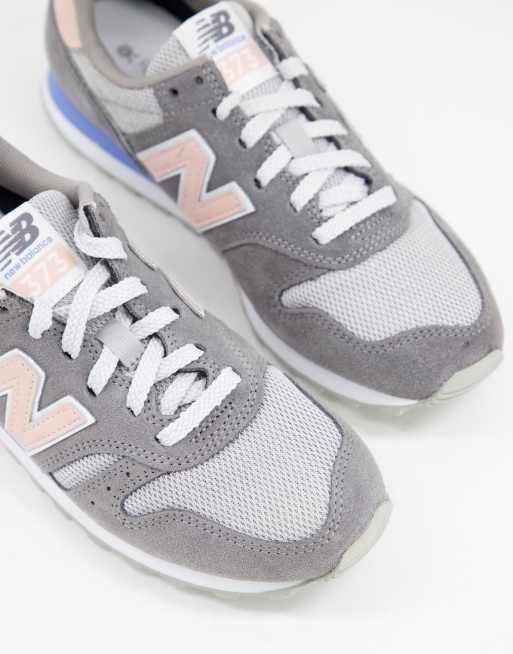 New Balance 373 trainers in grey and pink