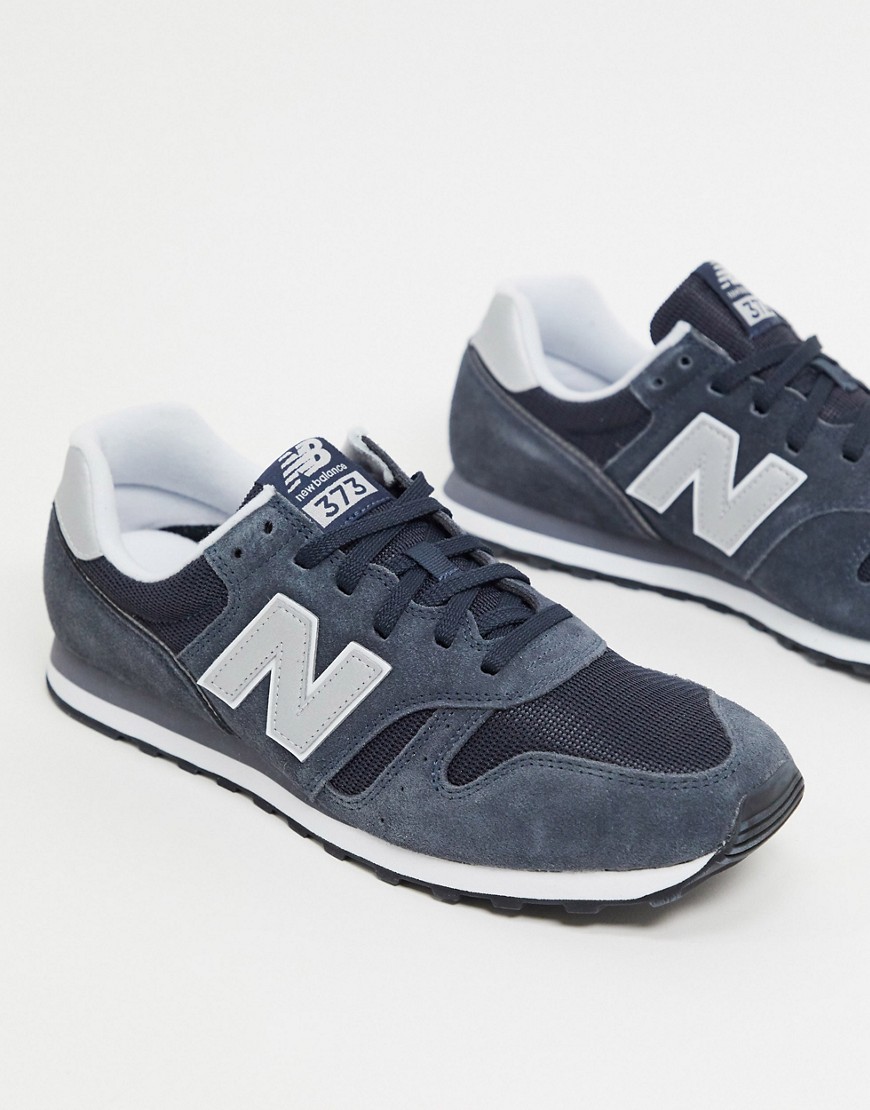 New Balance 373 trainers in navy and grey