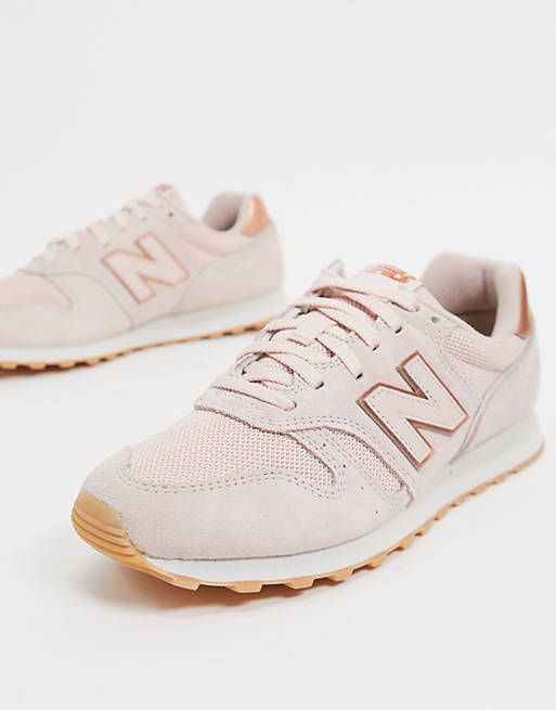New Balance 373 trainers in pink and rose gold