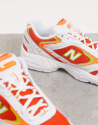 New Balance - 452 - Sneakers in oranje met wit | ASOS