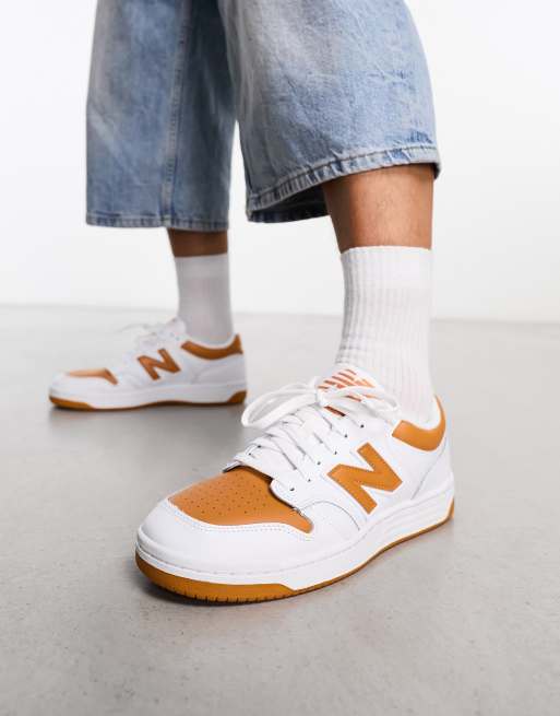 New Balance 480 trainers in white and orange