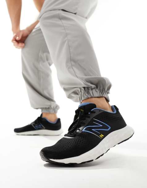 Mens all black hot sale new balance trainers