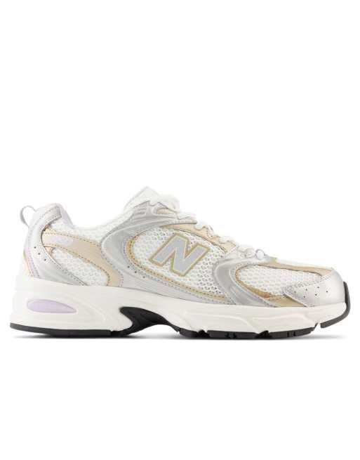 New balance grise store et doré