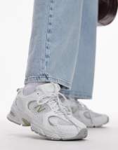 New Balance 530 trainers in light brown and leopard print