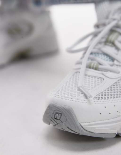 New Balance 530 trainers in white and light green