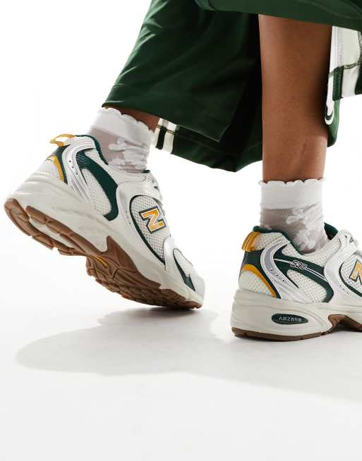 New Balance 530 collegiate sneakers in white green and gold Exclusive at ASOS