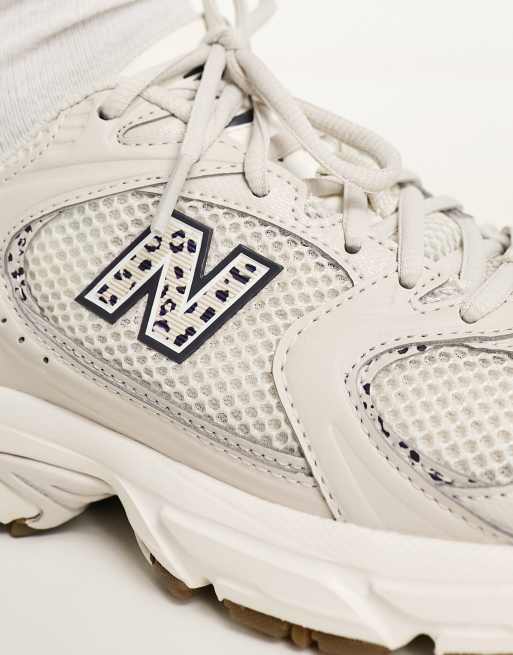 New Balance 530 trainers in beige and leopard print - exclusive to ASOS