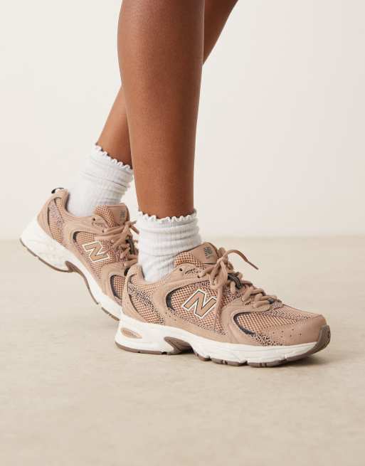 New Balance 530 sneakers in beige and leopard print