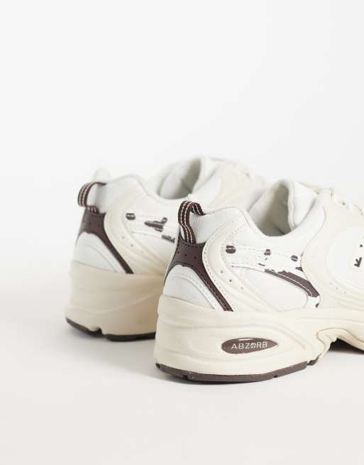 New Balance 530 sneakers in gebroken wit en koeienprint, 4 van 5