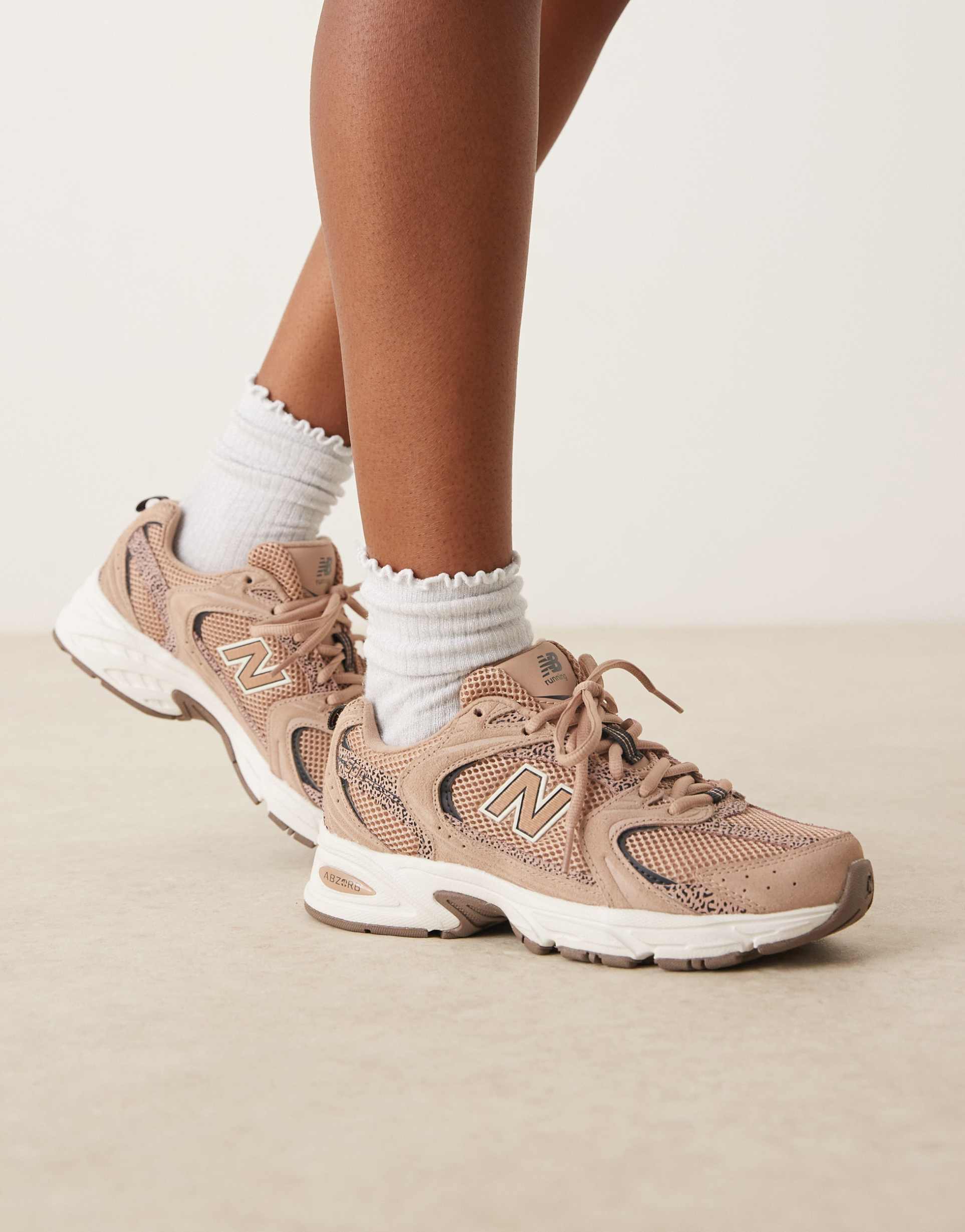 new balance 530 sneakers in light brown and leopard print