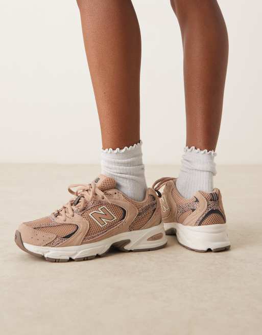 New Balance 530 trainers in light brown and leopard print