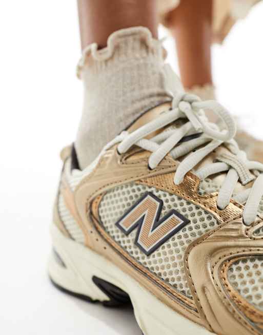 New Balance 530 sneakers in metallic bronze