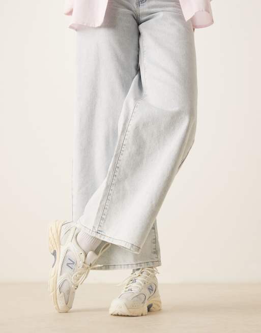 New Balance 530 sneakers in off white and blue detail
