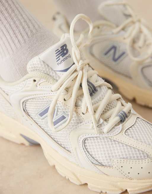 New Balance 530 sneakers in off white and blue detail
