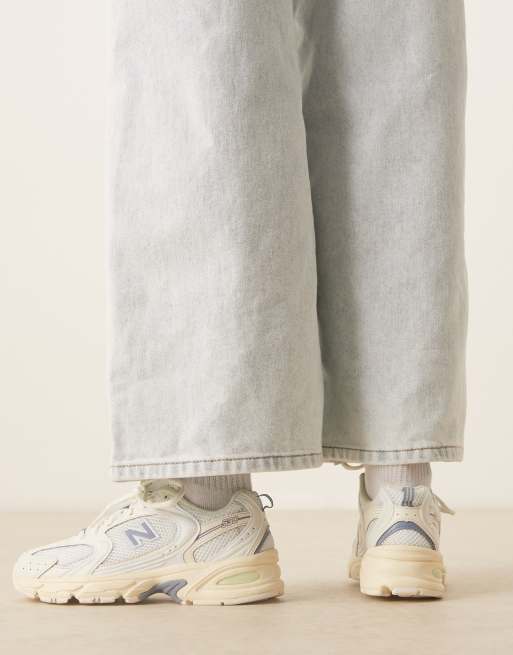 New Balance 530 sneakers in off white and blue detail