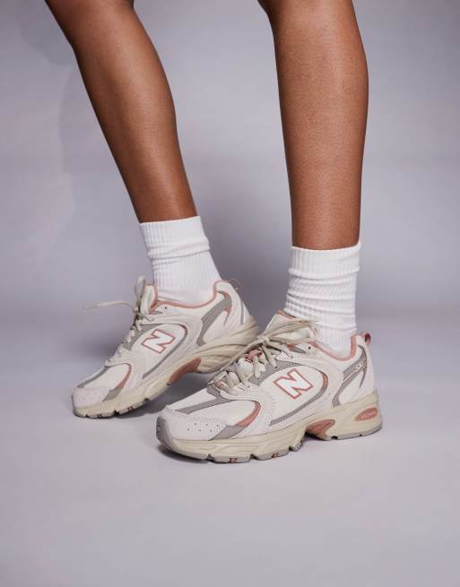 New Balance 530 sneakers in off white and red detail