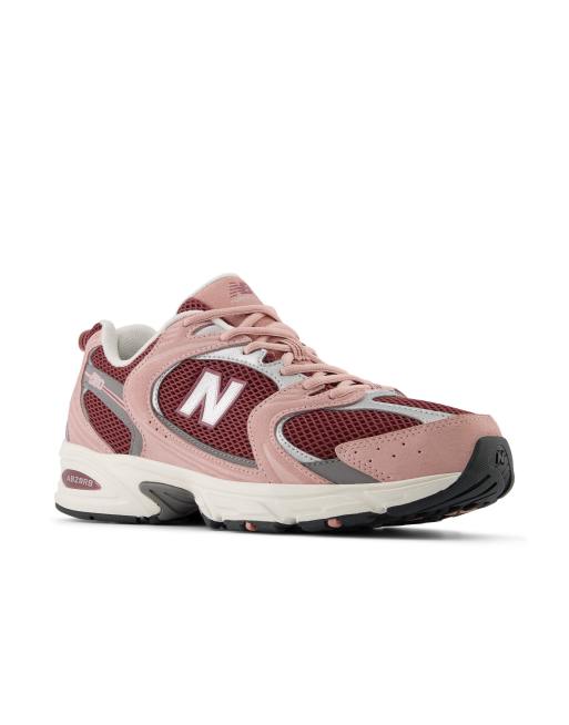 New Balance 530 sneakers in pink and burgundy