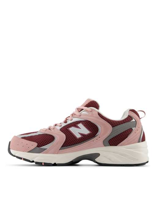 New Balance 530 sneakers in pink and burgundy