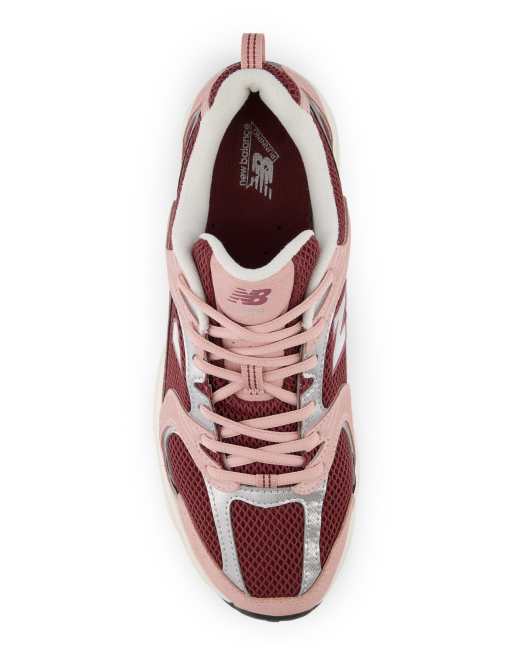 New Balance 530 sneakers in pink and burgundy