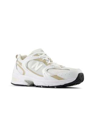 New Balance 530 sneakers in white and gold detail | ASOS