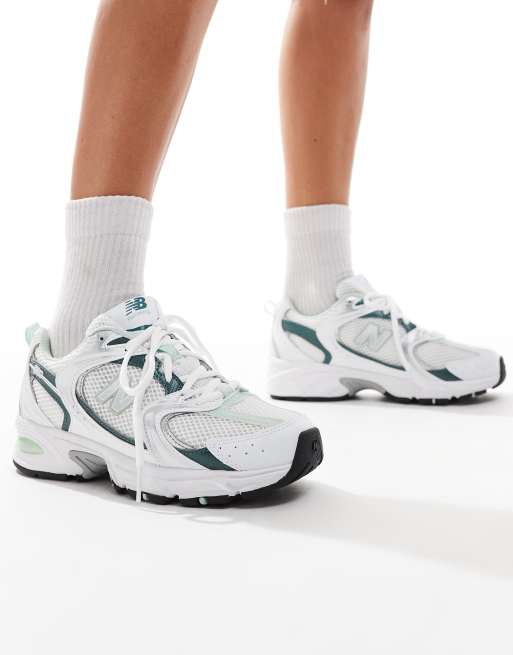 New Balance 530 sneakers in white and green