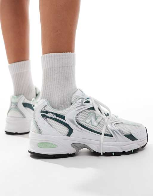 New Balance 530 sneakers in white and green