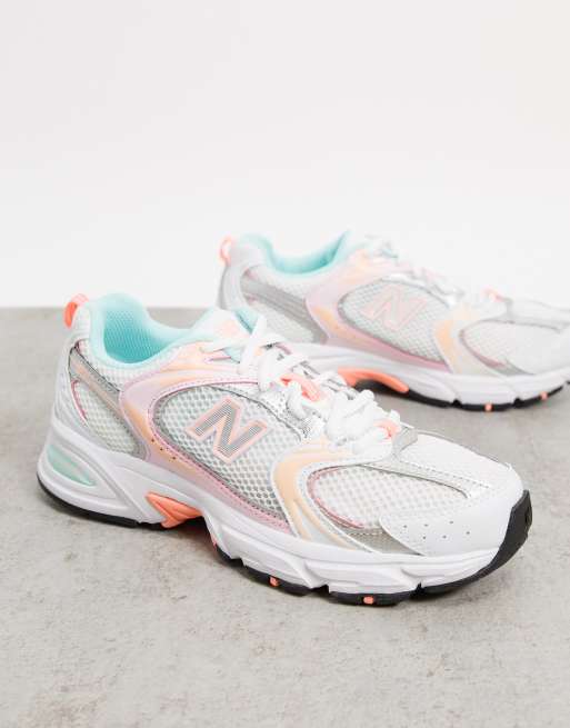 New Balance 530 sneakers in white and orange