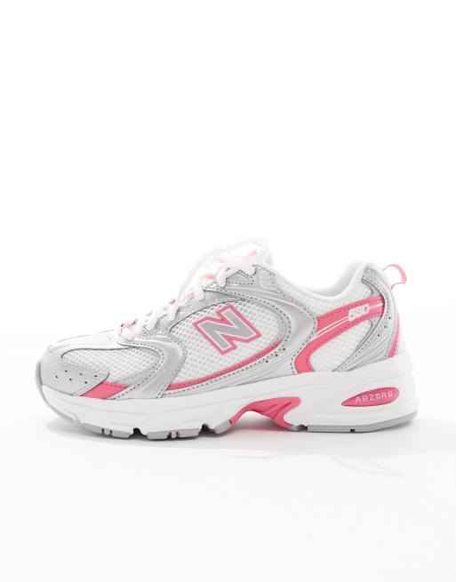 New Balance 530 sneakers in white and silver with pink detailing
