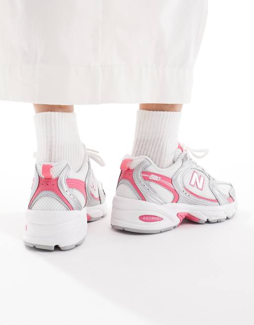 New Balance 530 sneakers in white and silver with pink detailing