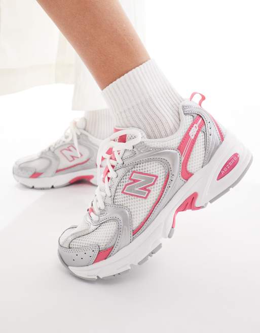 New Balance 530 sneakers in white and silver with pink detailing