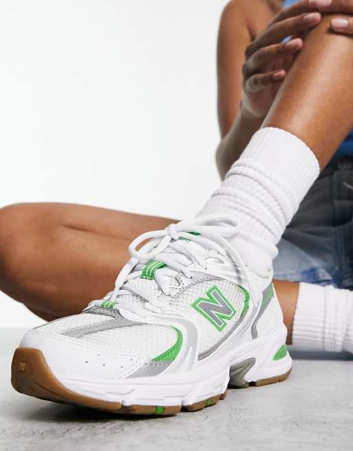 New Balance 530 sneakers in white and green