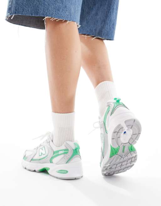 New Balance 530 sneakers in white, silver and green detail