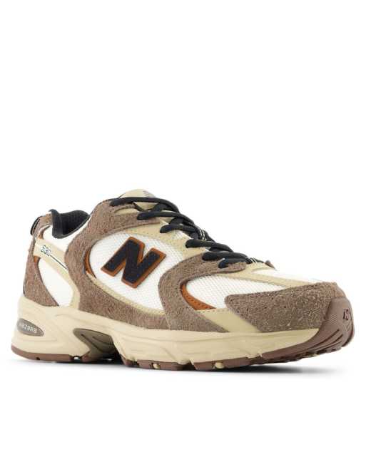 New Balance 530 sneakers in white with brown details