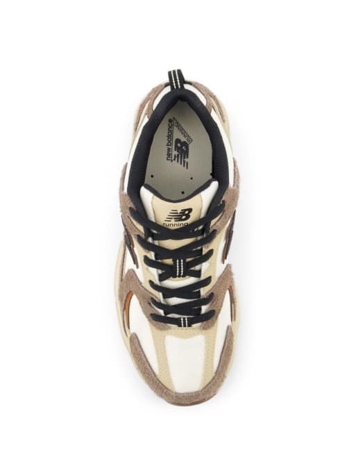 New Balance 530 sneakers in white with brown details