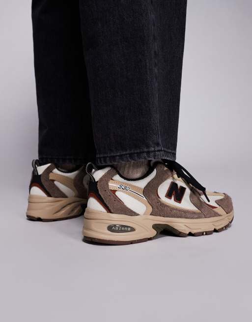 New Balance 530 sneakers in white with brown details