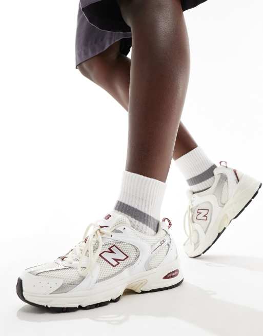 New Balance 530 sneakers in white with burgundy and silver details