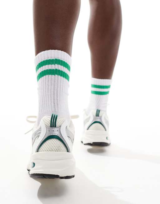 New Balance 530 sneakers in white with green and gray