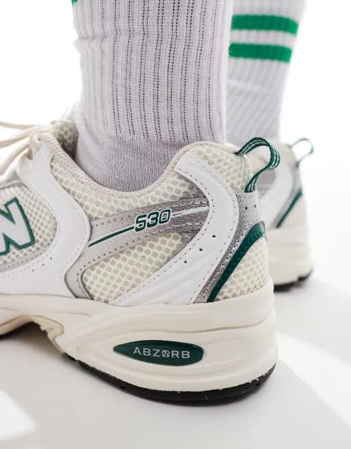New Balance 530 sneakers in white with green and gray details
