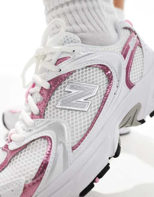 New Balance 530 sneakers in white with pink metallic details
