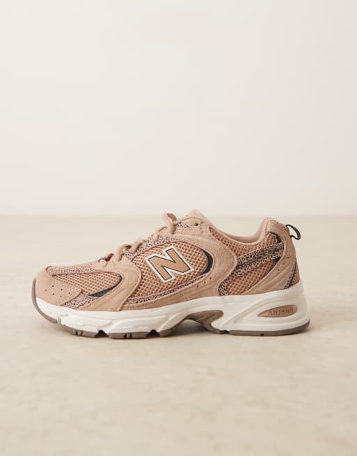 New Balance 530 trainers in light brown and leopard print